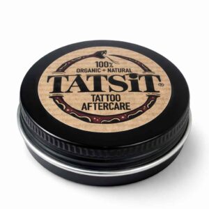 Tatsit tattoo aftercare balm in black tin on white background